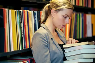 Woman reading in a library